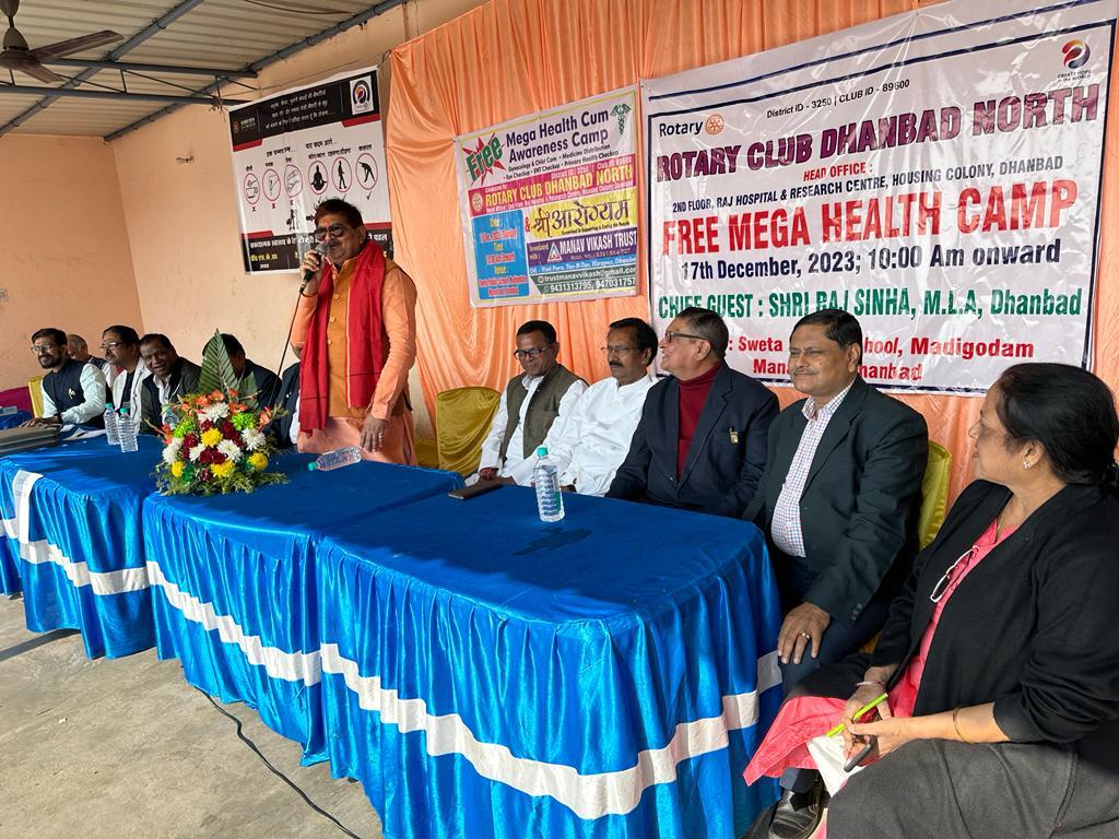 A photograph capturing a moment of community service and trust engagement.